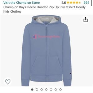 Girls size medium blue champion sweatshirt with pink lettering and long sleeves